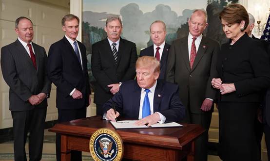 Donald Trump signs trade sanctions against China on Thursday. Photograph: Mandel Ngan/AFP/Getty Images