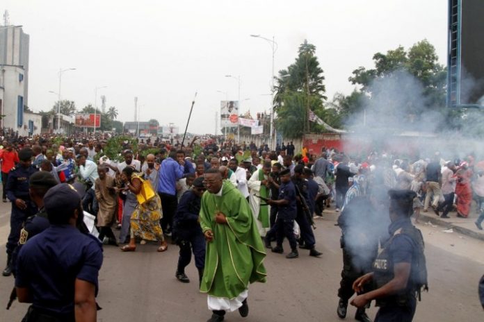 Riot police officers fired tear gas during a protest in Kinshasa the capital of the Democratic Republic of Congo