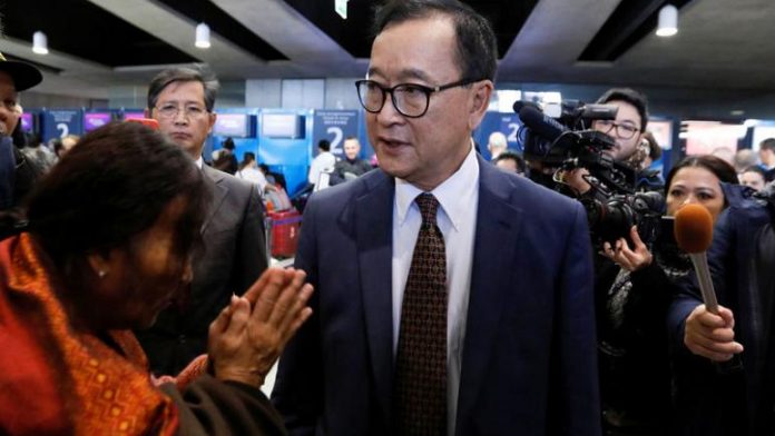 Sam Rainsy addressing journalist