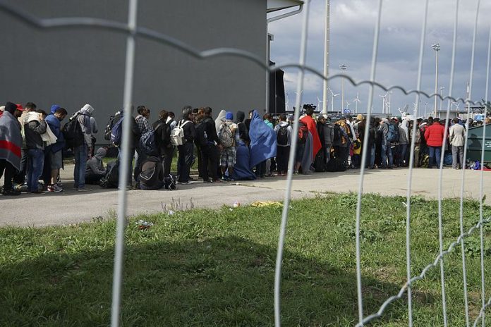 Syrian refugees crossing the border of Hungary and Austria