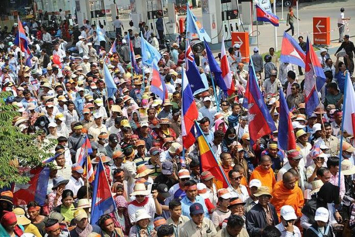 CNRP protesters raise flags