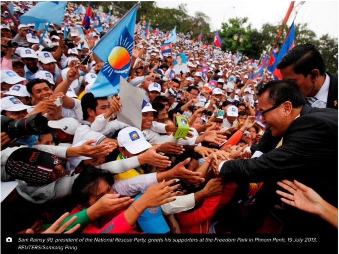 Sam Rainsy greets his supporters